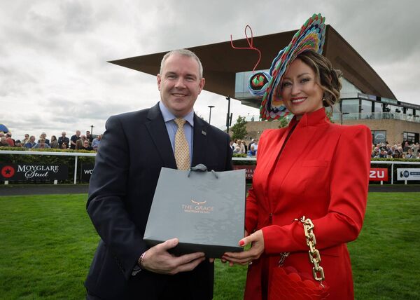 Ciaran Reidy, general manager of The Grace, Westport Estate presents style winner Laura Hanlon with her prize. Pic: Lorraine O'Sullivan