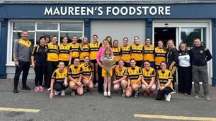 <p>The Four Roads senior camogie team presenting Maureen with a parting gift.</p> <p>The Four Roads senior camogie team presenting Maureen with a parting gift.</p>