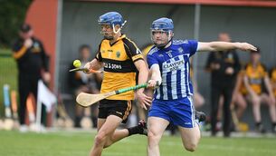 <p>Oisín Finneran, pictured here being tackled by Micheál Byrne, scored a famous late winner for Four Roads.</p>