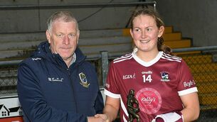 <p>Aisling Feely receives her Player of the Match award from Pat Heneghan, Roscommon LGFA Chairperson, following her side's victory against Clann na nGael on Saturday afternoon. Picture: Gerard O'Loughlin</p>