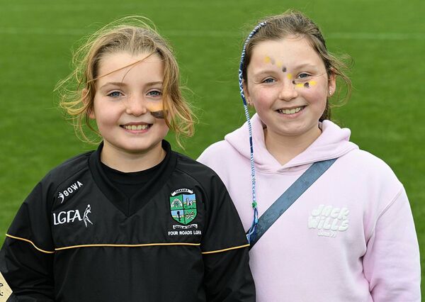 Bronagh Ní Cheallaigh and Katie McNeill supporting the Four Roads senior hurlers during their senior hurling championship success against St. Dominic's on Sunday last. Bronagh Ní Cheallaigh and Katie McNeill supporting the Four Roads senior hurlers during their senior hurling championship success against St. Dominic's on Sunday last.