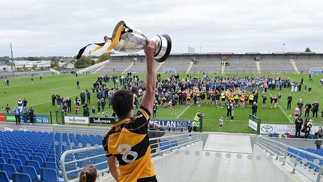 <p>THIS ONE IS FOR YOU: Four Roads captain, Tommy Morris, lifts the Mickey Cunniffe Cup in front of his team-mates and supporters as the Tisrara-based club is crowned Roscommon senior hurling champions for the 39th time at King and Moffatt Dr. Hyde Park on Sunday last. Pictures: Gerard O'Loughlin</p>