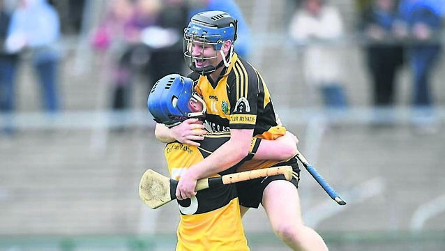 <p>WE DID IT: Conor Morris celebrates with Rory Coyle following Four Roads' dramatic victory against St. Dominic's in Sunday's senior hurling championship final at King and Moffatt Dr. Hyde Park.</p>