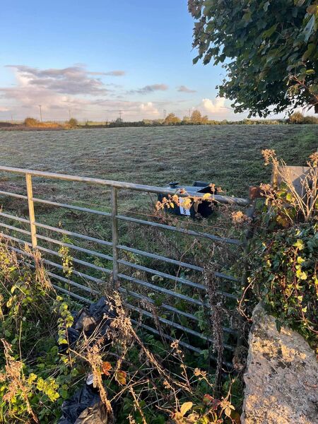 A bin thrown into a field. A bin thrown into a field.