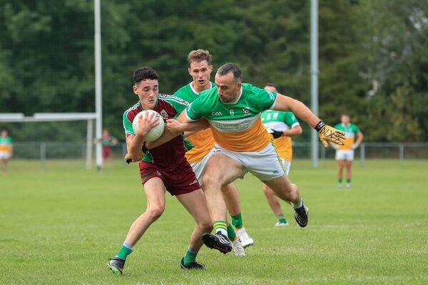 Dara Curran, pictured here being challenged by Thomas Featherston made a seismic impact in his debut season at adult level.