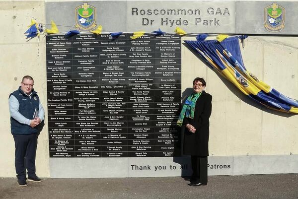 Roscommon GAA Chairperson, Thomas Murray, and special guest, Eileen Fahey, at the Patrons Wall, which was officially unveiled at King and Moffatt Dr. Hyde Park on Saturday last. Picture: Roscommon GAA