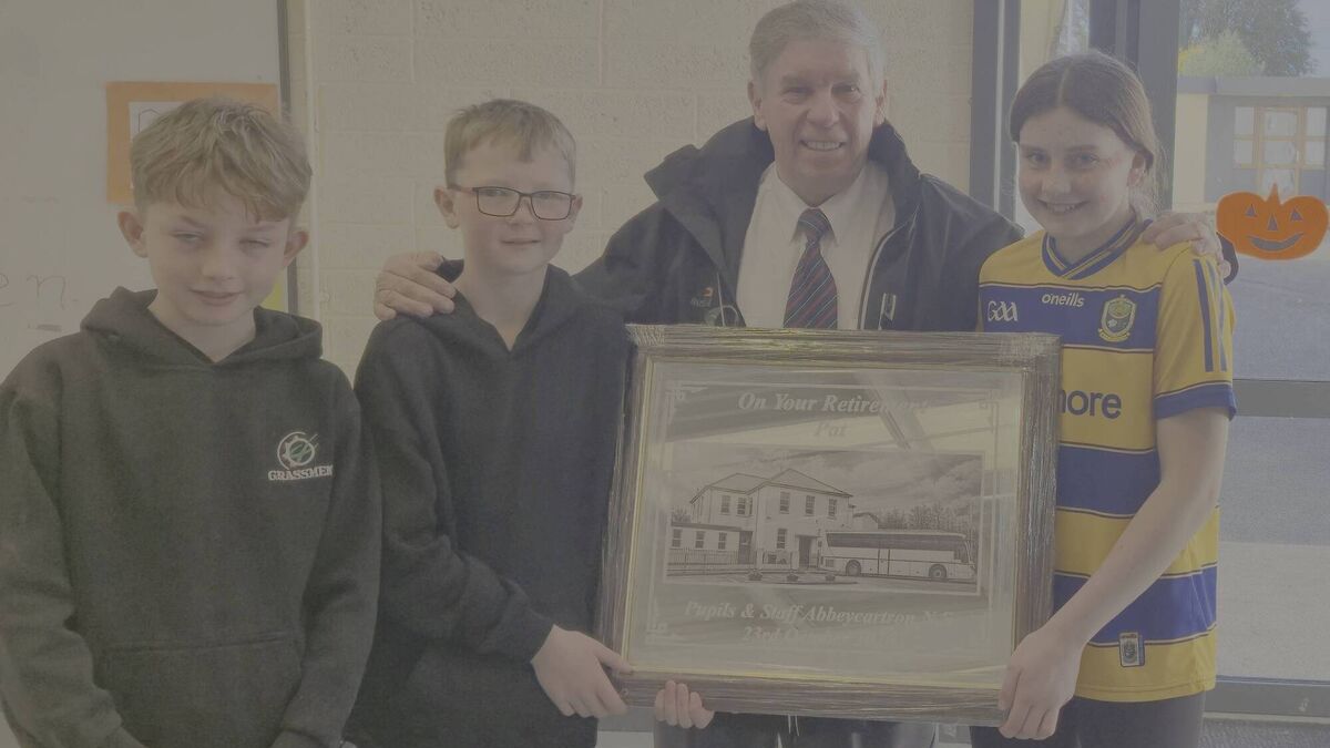 Children make presentation to popular County Roscommon school bus driver on his retirement