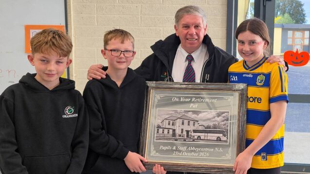 Children make presentation to popular County Roscommon school bus driver on his retirement
