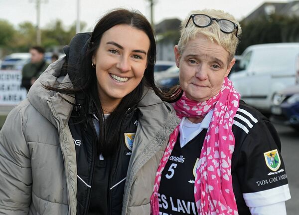 Rebecca Finan and Catherine Walsh supporting the Éire Óg intermediate footballers during their historic victory against Tulsk in the Hyde on Sunday last. 